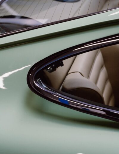 Chrome window trim on the green Revolt Electric bodywork