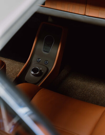 Tan centre console and drive controls inside the Revolt Electric