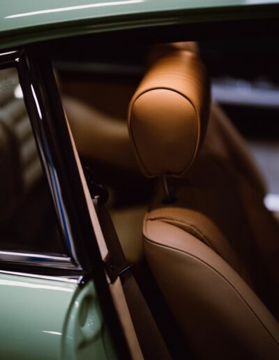 Tan leather headrest and front seat inside the Revolt Electric
