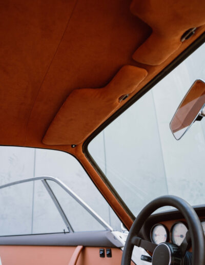 Tan roof lining and dashboard inside the Revolt Electric