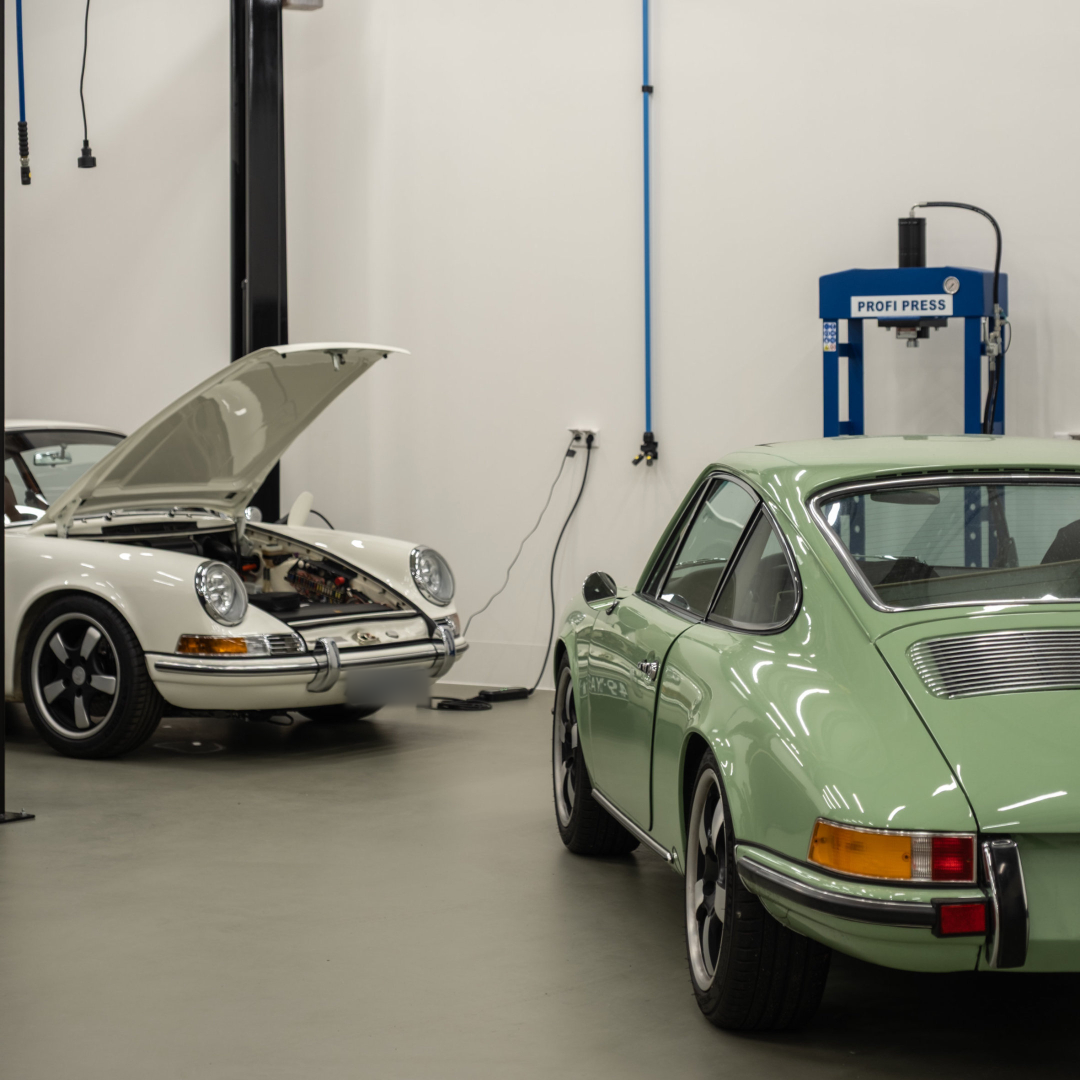 White and green Revolt Electrics inside the atelier